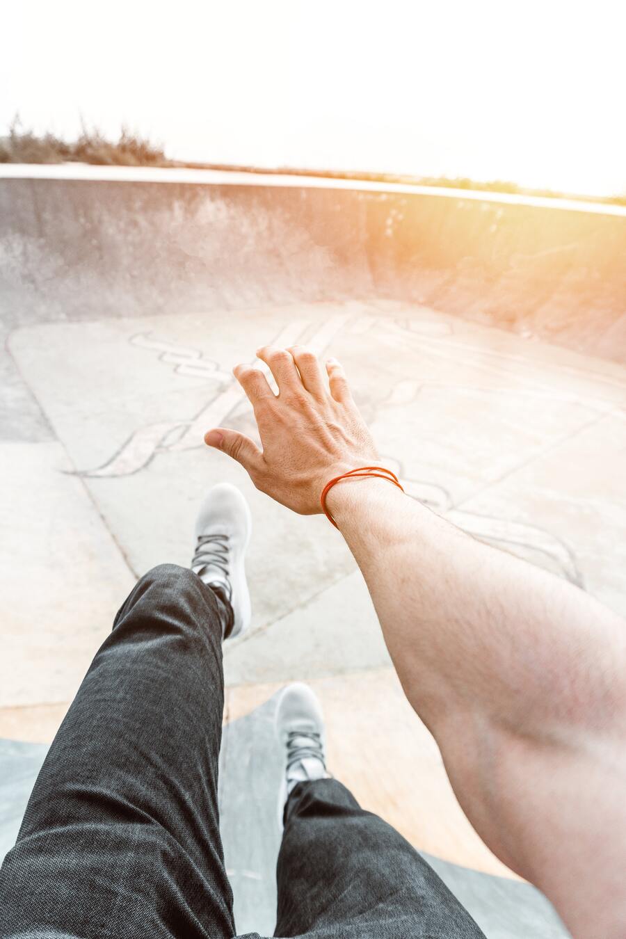 Using a red string bracelet in right hand